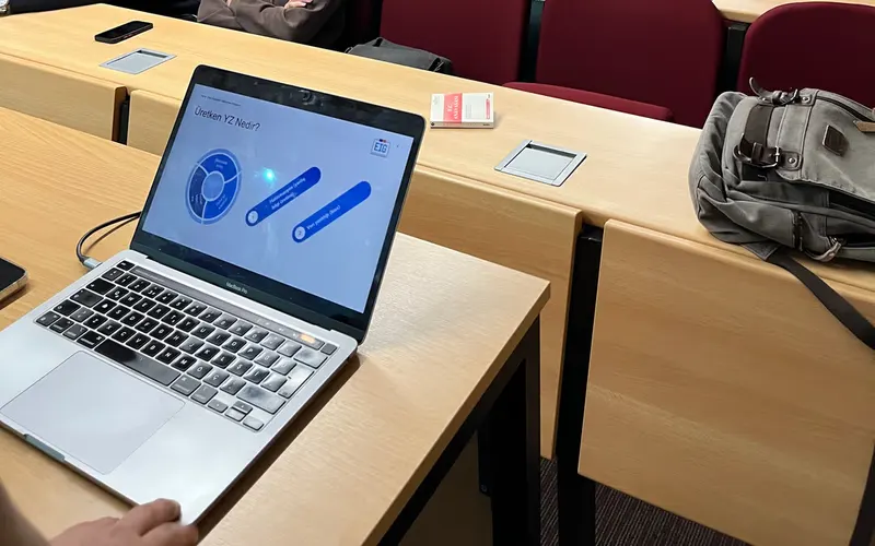 University students attending an AI seminar in a lecture hall