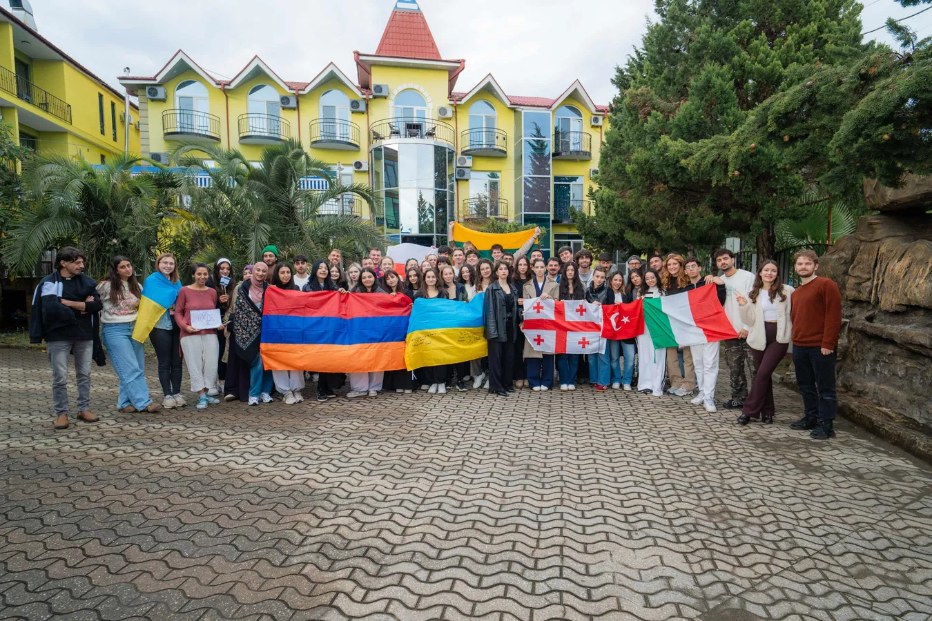 EIG participants holding national flags of Armenia, Ukraine, Georgia, Türkiye and Italy