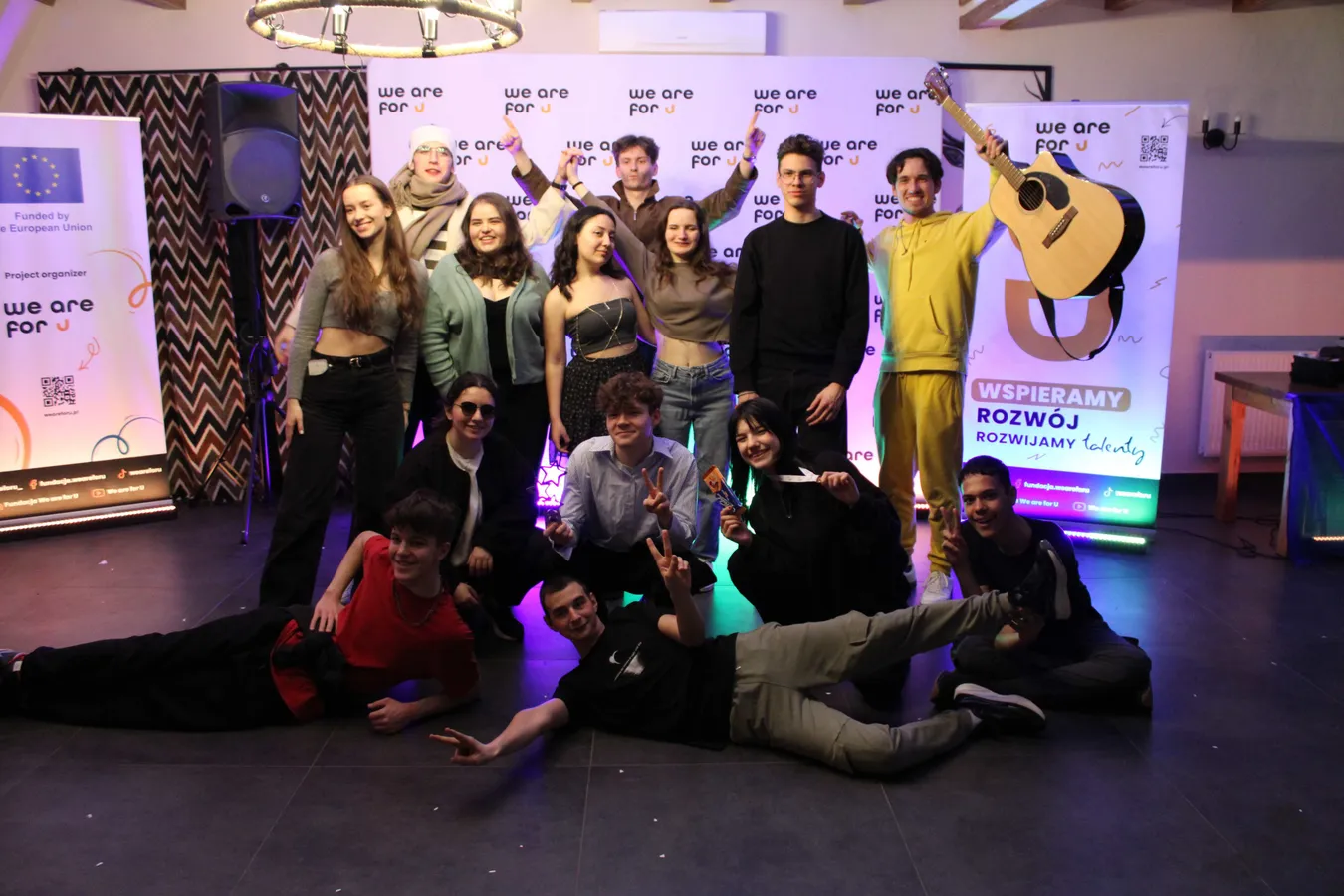Group of participants celebrating at a "we are for U" project event