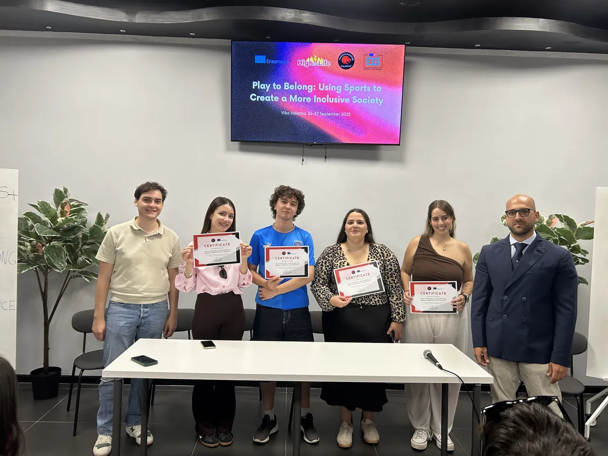 Participants receiving certificates at the Play to Belong project
